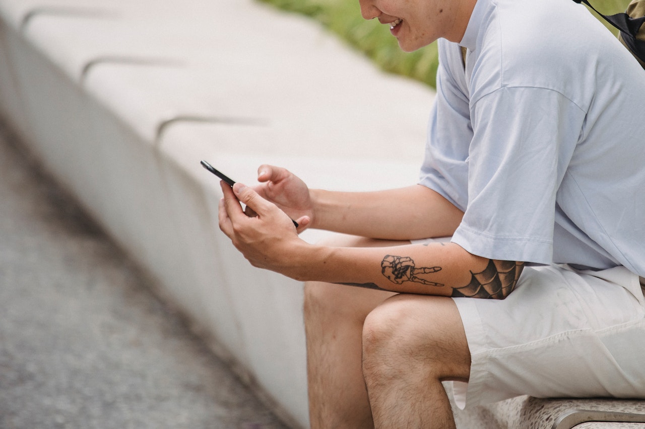 Teenager looks at a smartphone